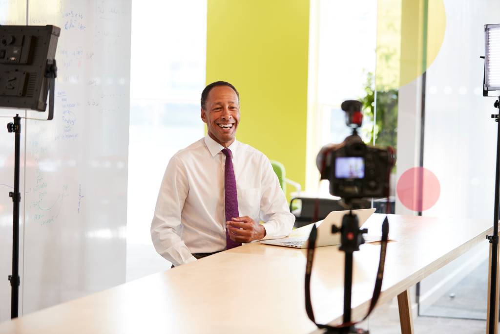 Middle age businessman making a corporate videos
